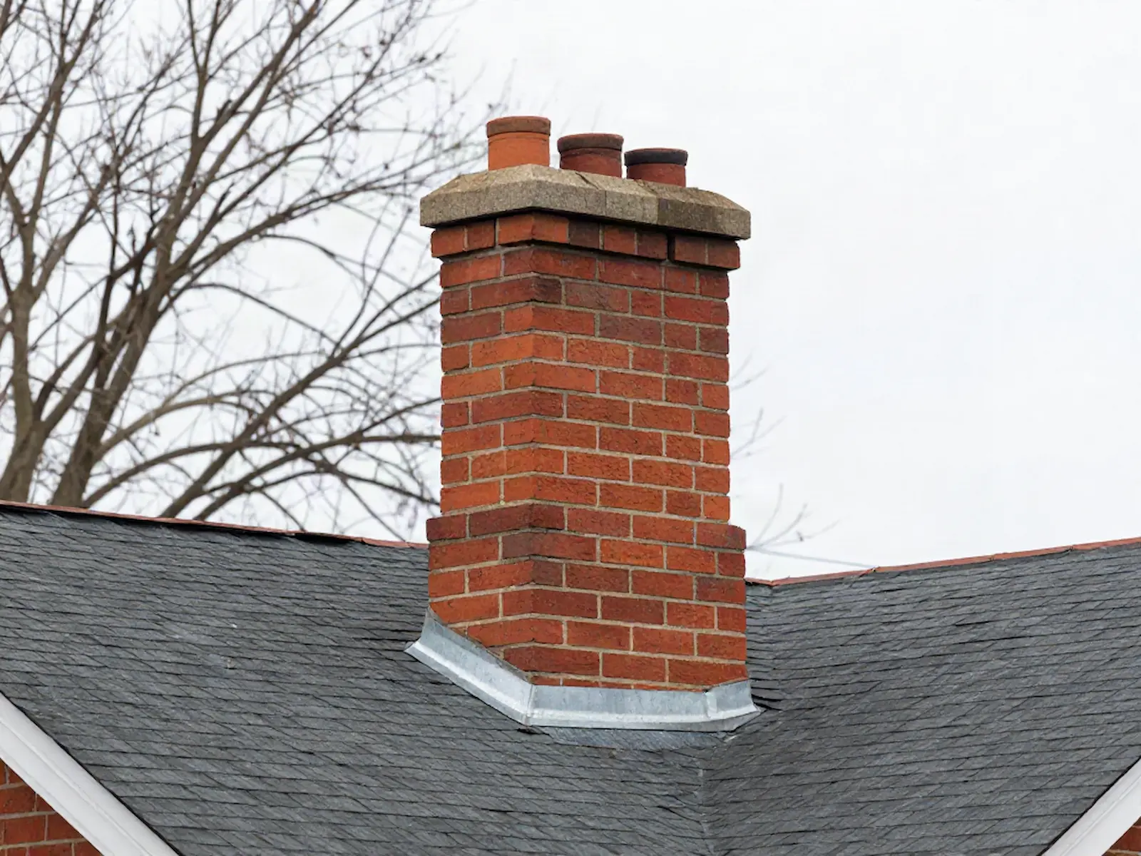 Brick chimney on a home served by Lucky 7 Chimney Sweeps in Philadelphia, PA